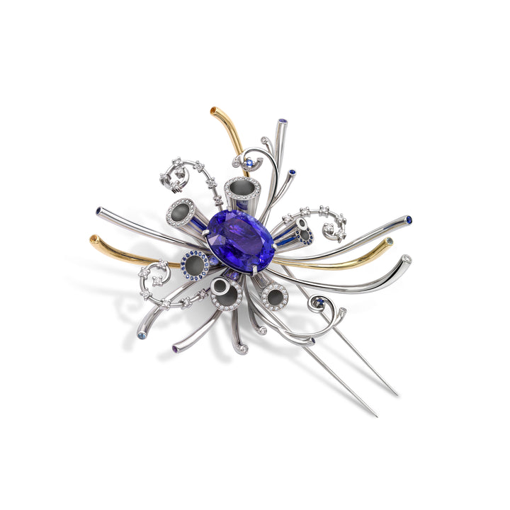 Quark Brooch inspired by the Large Hadron Collider featuring a tanzanite set in platinum and gold and diamonds